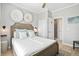 Cozy bedroom featuring bright natural light, wood headboard, and neutral decor for a relaxing ambiance at 40 Grand Pavilion Blvd, Isle of Palms, SC 29451