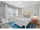 Bright bedroom with a charming bed, surfboard decor, and beachy accents for a relaxed vibe at 40 Grand Pavilion Blvd, Isle of Palms, SC 29451