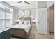 Bright bedroom featuring a wood bed frame, ceiling fan, and stylish decor, creating a peaceful retreat at 40 Grand Pavilion Blvd, Isle of Palms, SC 29451