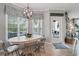 Charming dining area featuring a large window, stylish light fixture, and access to the outdoors at 40 Grand Pavilion Blvd, Isle of Palms, SC 29451