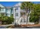 Charming two-story home with a spacious front porch, beautiful landscaping, and inviting curb appeal at 40 Grand Pavilion Blvd, Isle of Palms, SC 29451