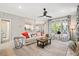 Open-concept living room with stylish furniture, large windows, and inviting decor at 40 Grand Pavilion Blvd, Isle of Palms, SC 29451