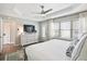 Bright main bedroom featuring a large window, tray ceiling, and ample storage space at 40 Grand Pavilion Blvd, Isle of Palms, SC 29451