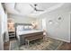 Beautiful main bedroom with soft green walls, bench, and large decorative rug at 40 Grand Pavilion Blvd, Isle of Palms, SC 29451