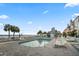 Inviting community pool with lounge chairs, palm trees, and ocean views for ultimate relaxation at 40 Grand Pavilion Blvd, Isle of Palms, SC 29451