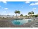 A luxurious pool deck featuring lounge chairs, palm trees, and direct access to the beach at 40 Grand Pavilion Blvd, Isle of Palms, SC 29451