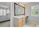 Bathroom vanity with a large mirror, vanity lighting, and neutral tones at 41 Regency Oaks Dr, Summerville, SC 29485