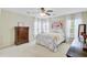 Inviting bedroom with a cozy bed, decorative pillows, dresser, and bright natural light at 41 Regency Oaks Dr, Summerville, SC 29485