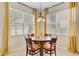 Cozy dining area with modern table, chairs, pendant lighting, and bright windows at 41 Regency Oaks Dr, Summerville, SC 29485