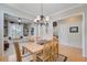 Dining room with hardwood floors, stylish lighting, and views into living spaces at 41 Regency Oaks Dr, Summerville, SC 29485