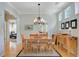 Elegant dining room with hardwood floors, stylish lighting, and a view into the living area at 41 Regency Oaks Dr, Summerville, SC 29485