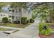 Charming two-story home with a welcoming front porch and a detached garage at 41 Regency Oaks Dr, Summerville, SC 29485