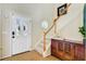 Bright foyer featuring hardwood floors, staircase, and a view through the front door at 41 Regency Oaks Dr, Summerville, SC 29485
