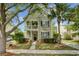Charming two-story home with a welcoming porch, lush landscaping, and mature trees, showcasing curb appeal at 41 Regency Oaks Dr, Summerville, SC 29485