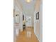 Bright hallway with hardwood floors leading to the front door and other areas of the home at 41 Regency Oaks Dr, Summerville, SC 29485