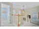 Upstairs hallway features a wood banister, plush carpet, and decorative lighting at 41 Regency Oaks Dr, Summerville, SC 29485