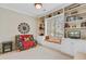 Cozy office with built-in shelving, a window seat, and a comfortable seating area at 41 Regency Oaks Dr, Summerville, SC 29485