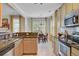 Modern kitchen boasts stainless steel appliances, granite countertops and connects to a dining area at 41 Regency Oaks Dr, Summerville, SC 29485