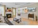 Inviting living room with a fireplace, television, and easy access to kitchen and dining areas at 41 Regency Oaks Dr, Summerville, SC 29485