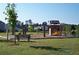 Community playground featuring a swing set and slide for children to enjoy at 41 Regency Oaks Dr, Summerville, SC 29485