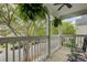 Charming porch with ferns hanging, offering a relaxing outdoor space and neighborhood view at 41 Regency Oaks Dr, Summerville, SC 29485