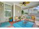Comfortable screened porch with woven furniture and cheerful decor at 41 Regency Oaks Dr, Summerville, SC 29485