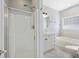 Bright bathroom featuring a glass shower, a soaking tub, and clean, modern finishes at 4926 Lake Palmetto Ln, North Charleston, SC 29418