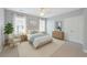 Bright bedroom featuring carpet floors, neutral decor, and double doors to the closet at 4926 Lake Palmetto Ln, North Charleston, SC 29418