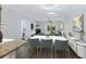 Elegant dining room with modern lighting, flowing into the cozy living room at 4926 Lake Palmetto Ln, North Charleston, SC 29418