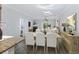 Elegant dining room with modern lighting, flowing into the cozy living room at 4926 Lake Palmetto Ln, North Charleston, SC 29418
