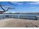 Beautiful lake view from the wooden community dock, featuring no diving sign and scenic seating area at 4926 Lake Palmetto Ln, North Charleston, SC 29418