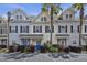 Charming townhouses with colorful doors, black shutters, and landscaped front yard at 4926 Lake Palmetto Ln, North Charleston, SC 29418