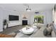 Bright living room with fireplace, modern furnishings and sliding glass door to backyard at 4926 Lake Palmetto Ln, North Charleston, SC 29418