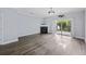 Bright living room with fireplace, sliding door to the patio, and modern chandelier at 4926 Lake Palmetto Ln, North Charleston, SC 29418