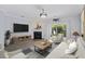 Cozy living room featuring a fireplace, stylish decor, and a sliding door to the outdoors at 4926 Lake Palmetto Ln, North Charleston, SC 29418