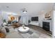 Inviting living room with open floor plan, fireplace, large screen TV, and modern furniture at 4926 Lake Palmetto Ln, North Charleston, SC 29418
