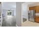 Open-concept living space with modern flooring, seamlessly connecting the kitchen and living room at 4926 Lake Palmetto Ln, North Charleston, SC 29418