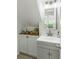 Charming powder room featuring a vanity with white countertop and a wood storage cabinet at 540 Castle Hall Rd, Mount Pleasant, SC 29464