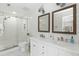 Bright bathroom with a glass shower, dual sinks, and classic subway tile at 540 Castle Hall Rd, Mount Pleasant, SC 29464