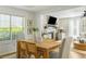 Bright dining area connected to the living room, featuring hardwood floors and stylish decor at 540 Castle Hall Rd, Mount Pleasant, SC 29464