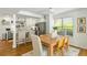 Bright dining area connected to the kitchen, featuring hardwood floors and stylish decor at 540 Castle Hall Rd, Mount Pleasant, SC 29464
