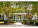 Charming building exterior with elegant columns and a welcoming entrance, framed by beautiful trees and landscaping at 540 Castle Hall Rd, Mount Pleasant, SC 29464