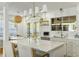 Bright and modern kitchen with a large center island, white cabinets, and stainless steel appliances at 540 Castle Hall Rd, Mount Pleasant, SC 29464