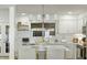 Bright kitchen featuring white cabinets, a subway tile backsplash, and modern appliances at 540 Castle Hall Rd, Mount Pleasant, SC 29464