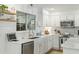 Modern kitchen featuring quartz countertops, white cabinets, stainless appliances, and open shelving at 540 Castle Hall Rd, Mount Pleasant, SC 29464