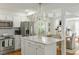 Bright kitchen with a large island, stainless steel appliances, and hardwood floors at 540 Castle Hall Rd, Mount Pleasant, SC 29464