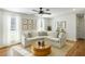 Cozy living room with modern furniture, natural light, hardwood floors and a beautiful decorative rug at 540 Castle Hall Rd, Mount Pleasant, SC 29464