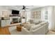 Bright living room featuring a fireplace, TV, modern furniture, and lots of natural light at 540 Castle Hall Rd, Mount Pleasant, SC 29464