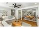 Cozy living room with modern furniture, opening into dining area and stairs to the second story at 540 Castle Hall Rd, Mount Pleasant, SC 29464