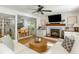 Open concept living space with fireplace, adjacent dining, and hardwood floors at 540 Castle Hall Rd, Mount Pleasant, SC 29464